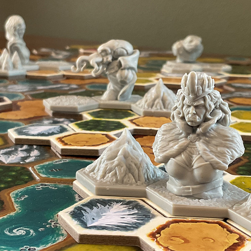 Plastic miniatures on top of cardboard game tiles