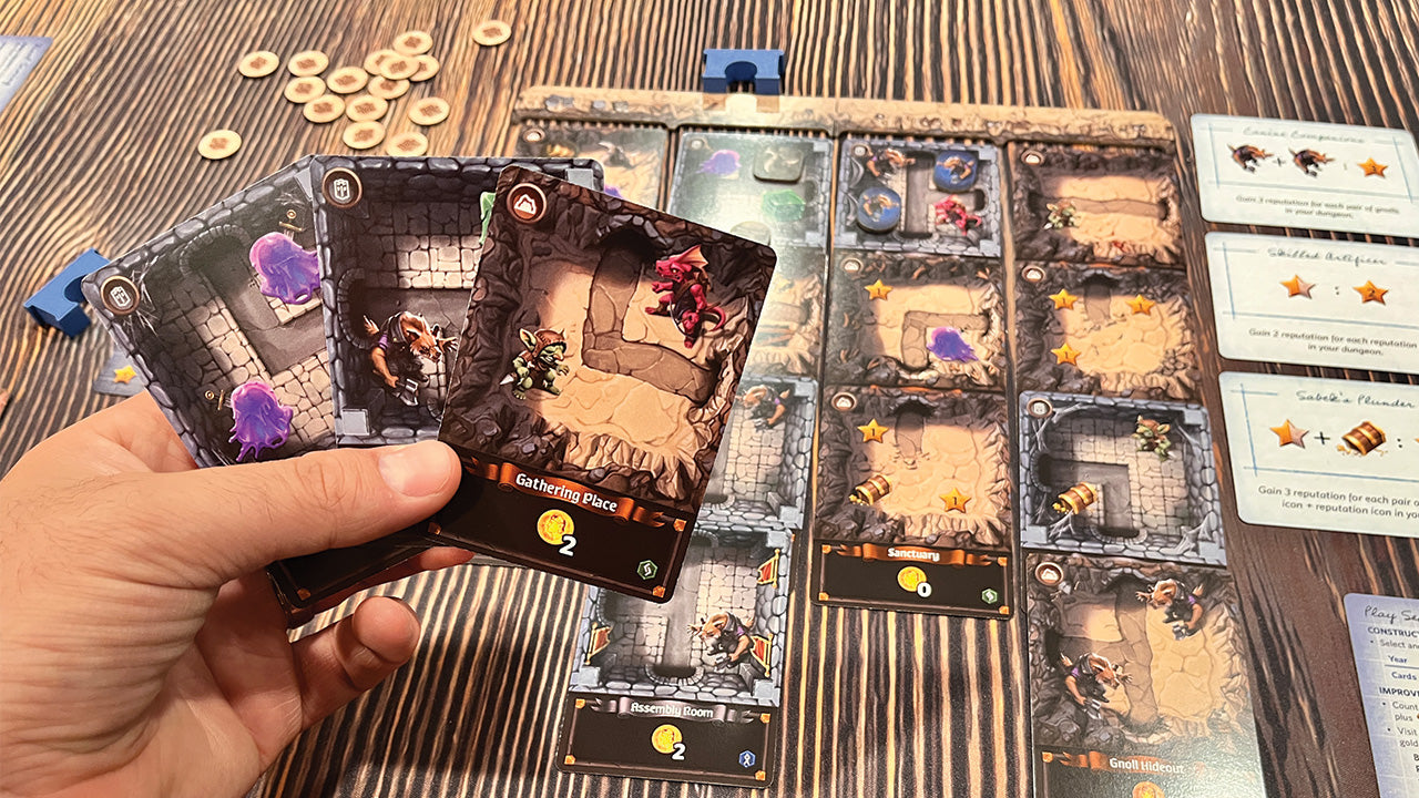 In-play image of Stonespine Architects. Focus on a hand of cards.