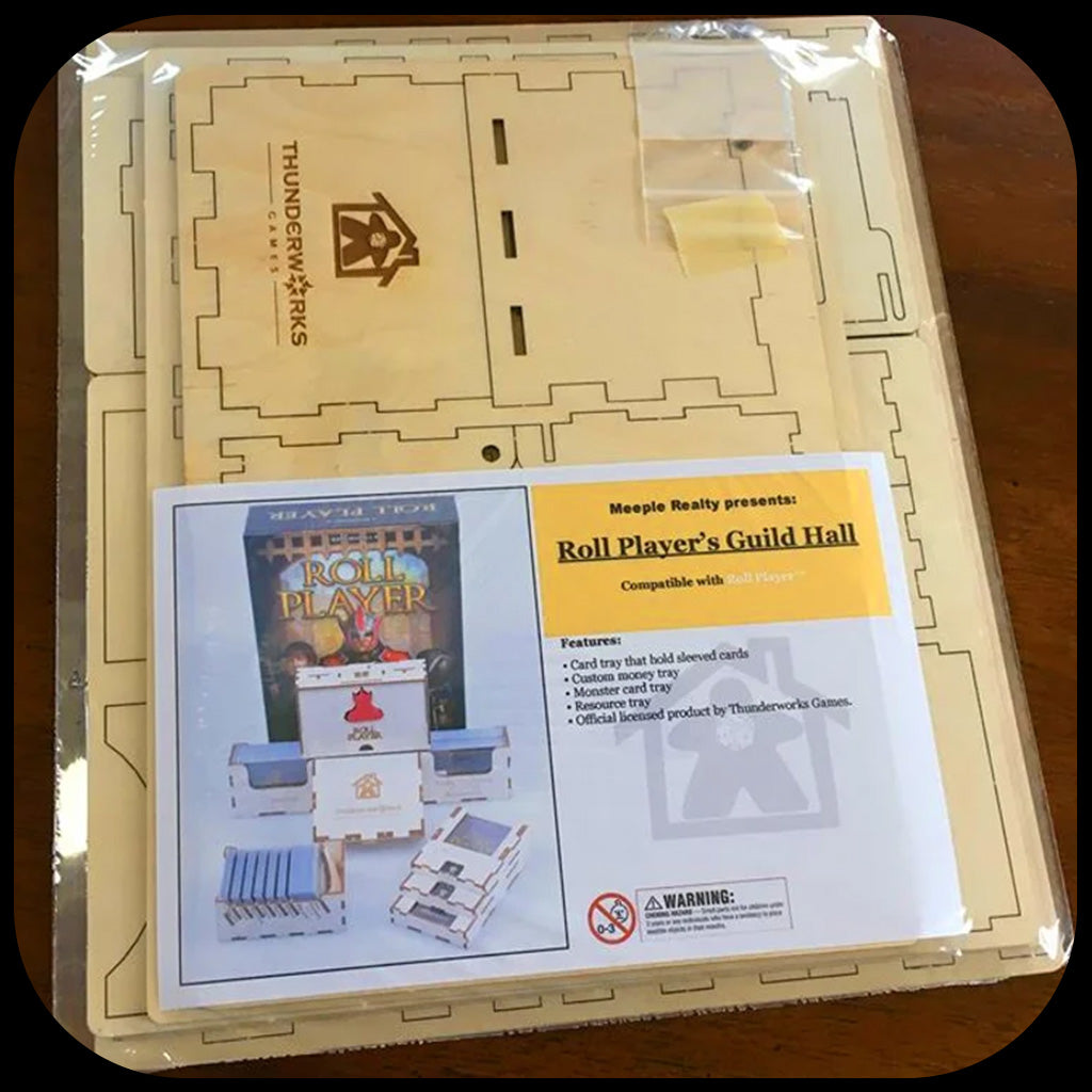 Wood insert for Roll Player shown in shrink wrap, flat-packed.